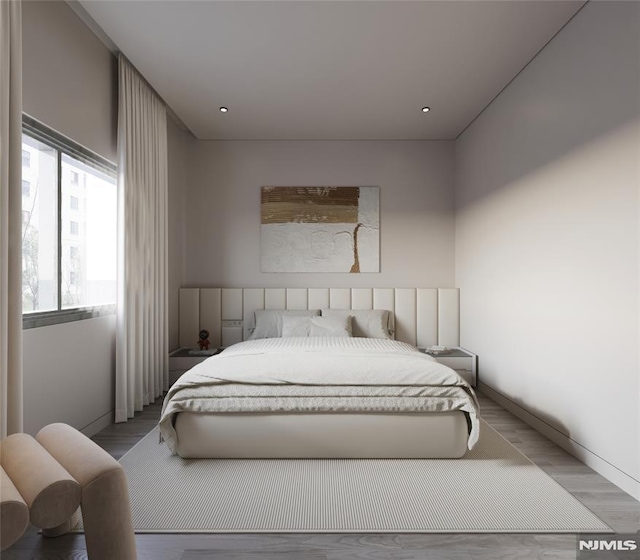 bedroom with wood-type flooring