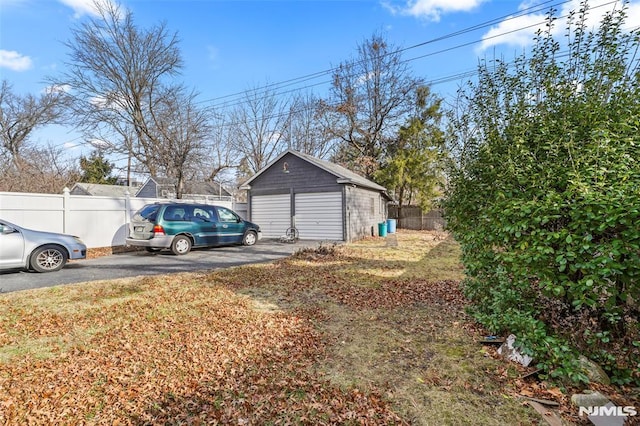 exterior space with an outdoor structure and a yard