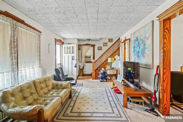 living room featuring light carpet and cooling unit