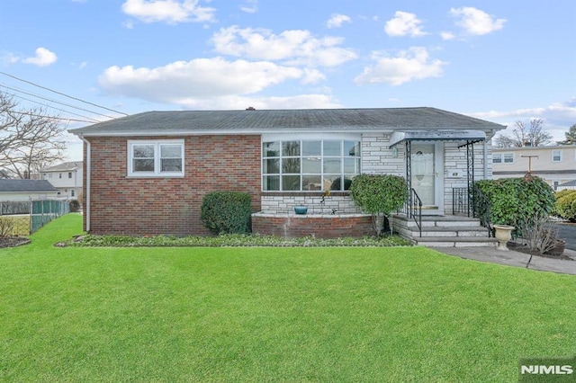 view of front of property with a front lawn