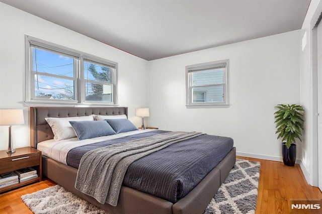 bedroom featuring wood-type flooring