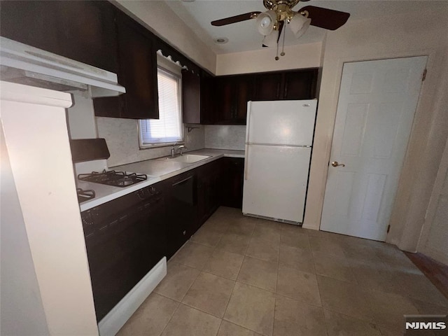 kitchen featuring ceiling fan, sink, backsplash, white appliances, and light tile patterned floors