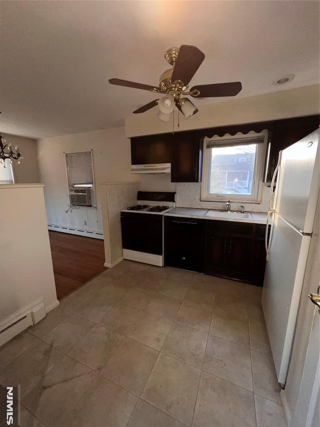 kitchen featuring light tile patterned flooring, white appliances, a baseboard radiator, and sink