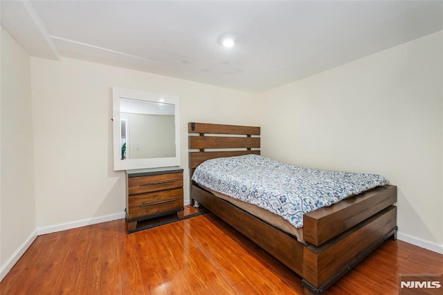 bedroom featuring hardwood / wood-style flooring