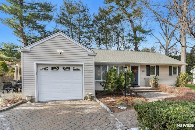 ranch-style house featuring a garage