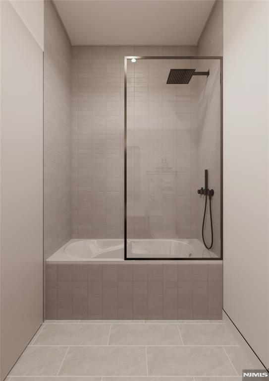 bathroom with tiled shower / bath combo and tile patterned floors