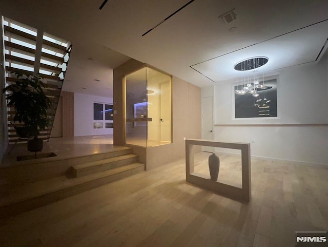 interior space with hardwood / wood-style flooring