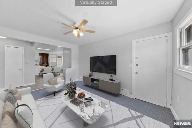 living room featuring ceiling fan