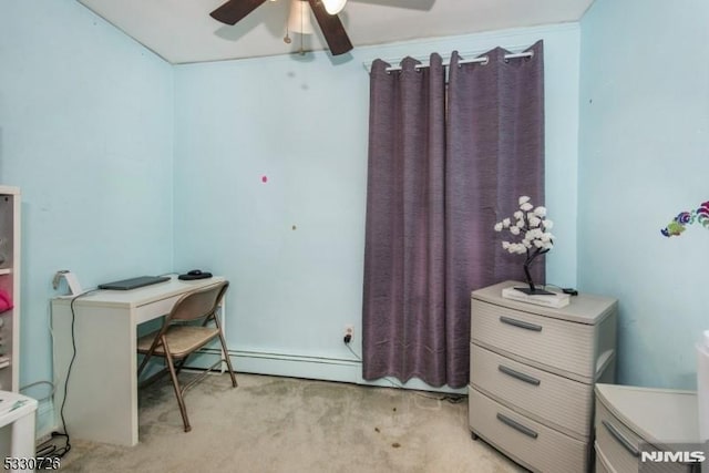 carpeted home office featuring baseboard heating and ceiling fan