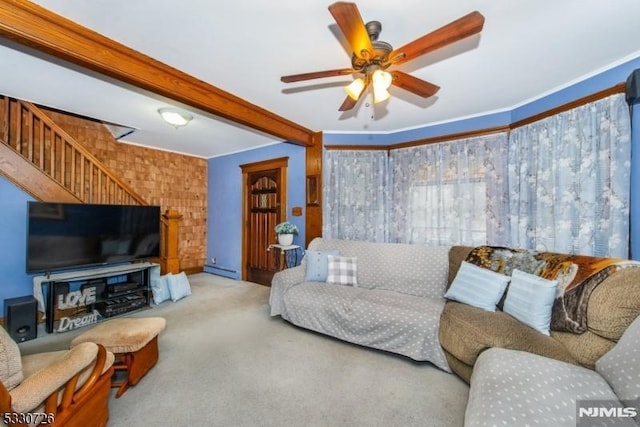 living room with light carpet, ornamental molding, ceiling fan, a baseboard radiator, and beamed ceiling