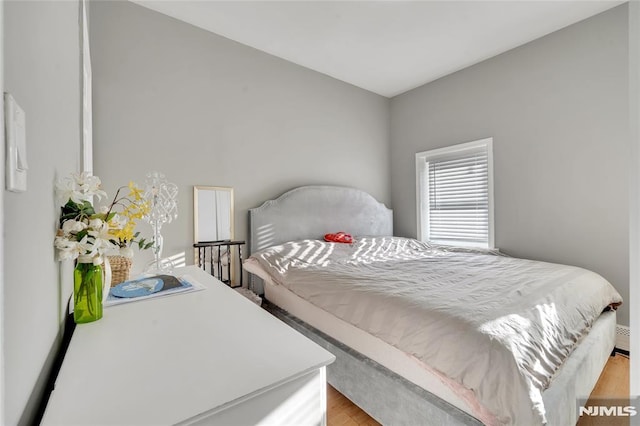 bedroom with light hardwood / wood-style flooring