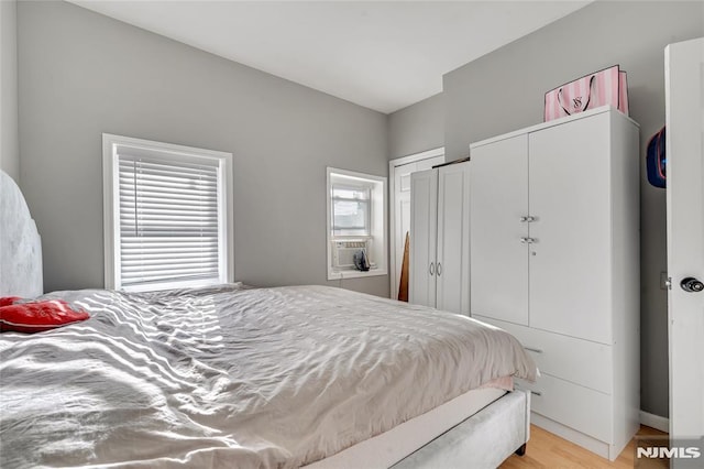 bedroom with light hardwood / wood-style flooring