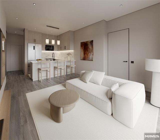 living room with dark hardwood / wood-style flooring and sink