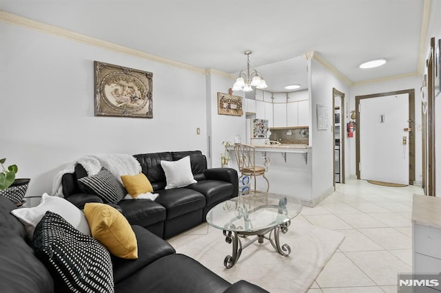 living room featuring a chandelier, ornamental molding, and light tile patterned flooring