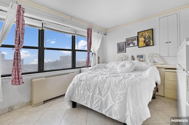 tiled bedroom with crown molding