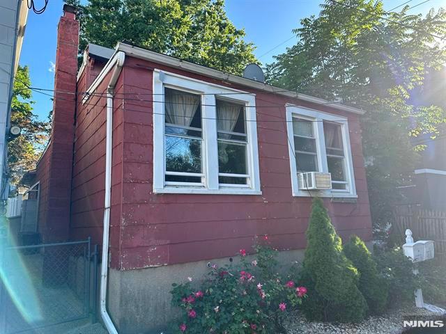 view of home's exterior with cooling unit