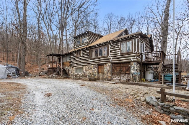 view of side of home featuring a deck