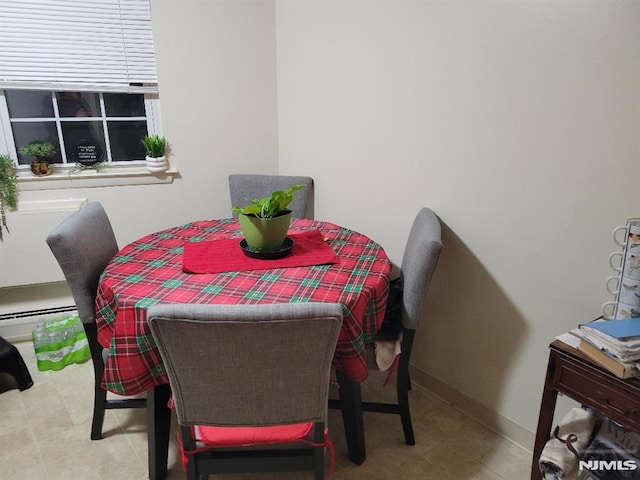 dining area featuring baseboard heating