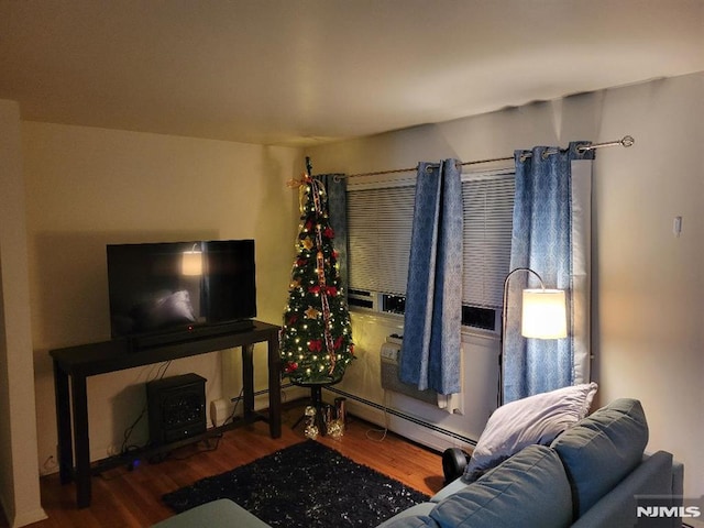 living room featuring dark hardwood / wood-style floors and a baseboard radiator