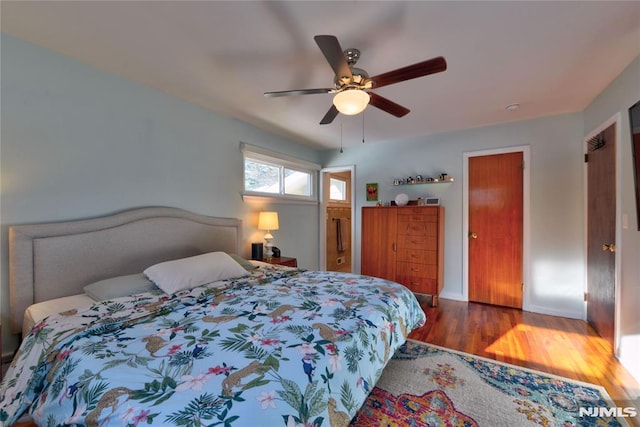 bedroom featuring ceiling fan and wood-type flooring