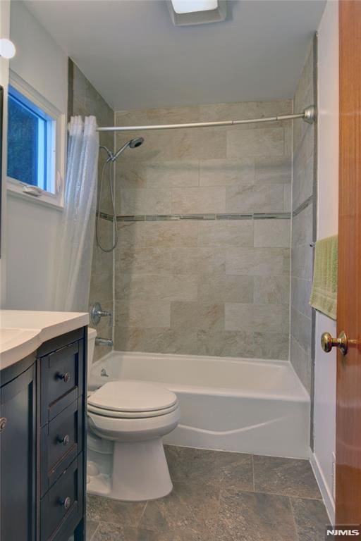 full bathroom with vanity, toilet, and shower / bath combo with shower curtain