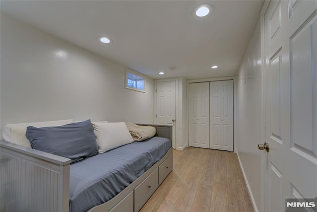 interior space featuring a closet and light hardwood / wood-style flooring