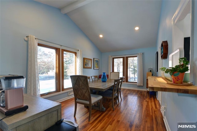 dining area with dark hardwood / wood-style flooring, beamed ceiling, and high vaulted ceiling