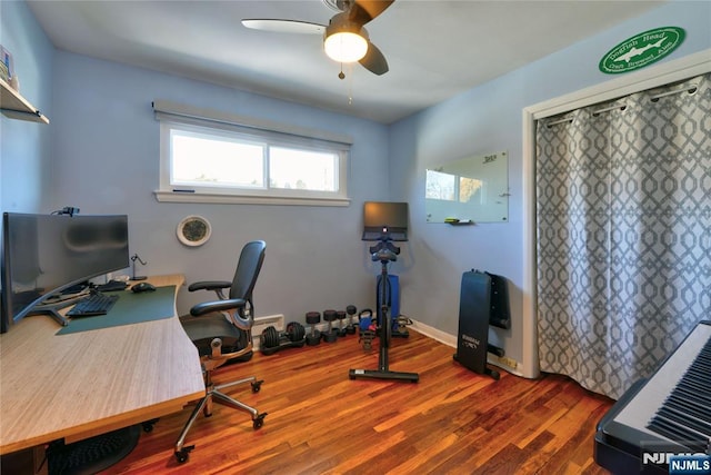 home office with ceiling fan, wood finished floors, and baseboards