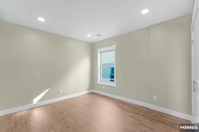 empty room featuring hardwood / wood-style floors