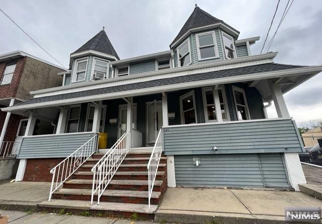 victorian-style house with covered porch