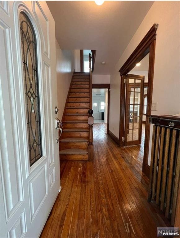 entrance foyer with dark hardwood / wood-style flooring