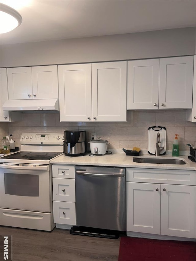 kitchen featuring dark hardwood / wood-style flooring, tasteful backsplash, stainless steel dishwasher, white electric stove, and white cabinets