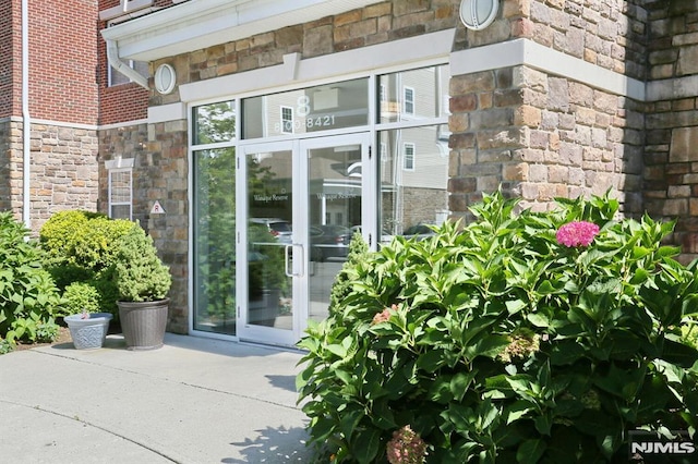 property entrance featuring french doors