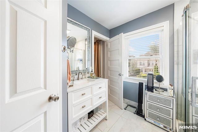 bathroom featuring vanity and an enclosed shower