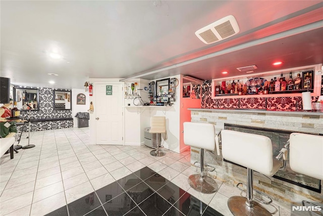 bar with tile patterned floors