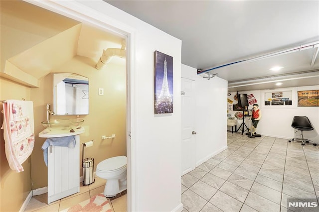 bathroom with tile patterned floors and toilet