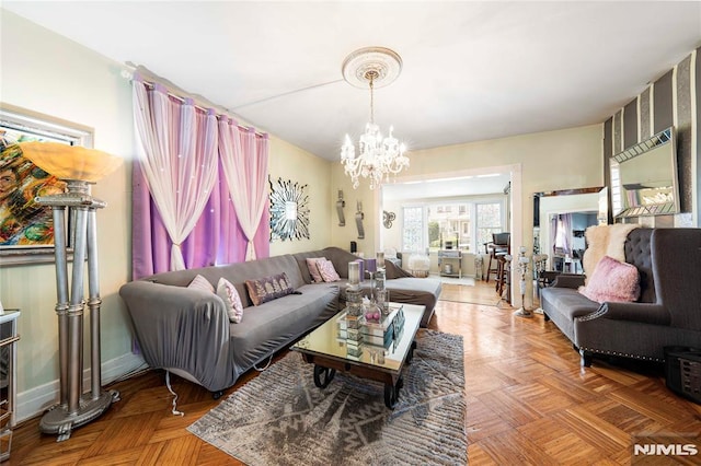 living room with parquet flooring and a chandelier