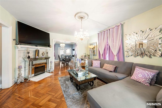 living room with parquet flooring and a chandelier