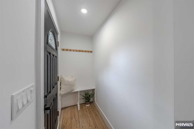 hall with light hardwood / wood-style floors