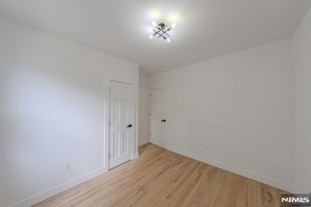 empty room with light wood-type flooring