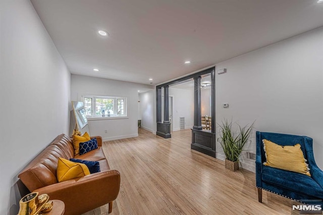 sitting room with light hardwood / wood-style flooring