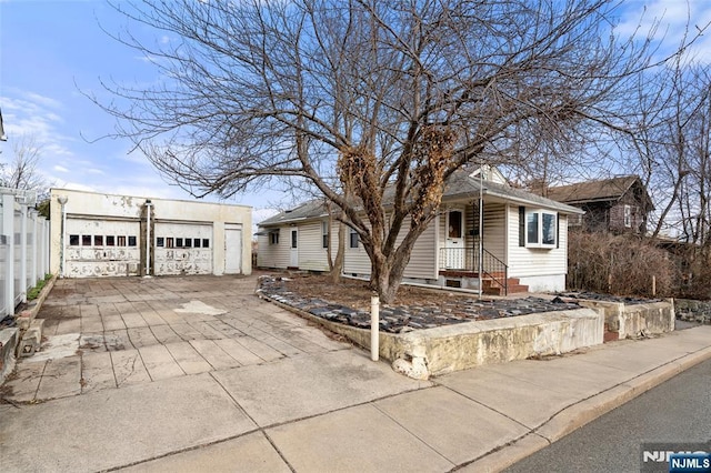 view of front facade with a garage and fence