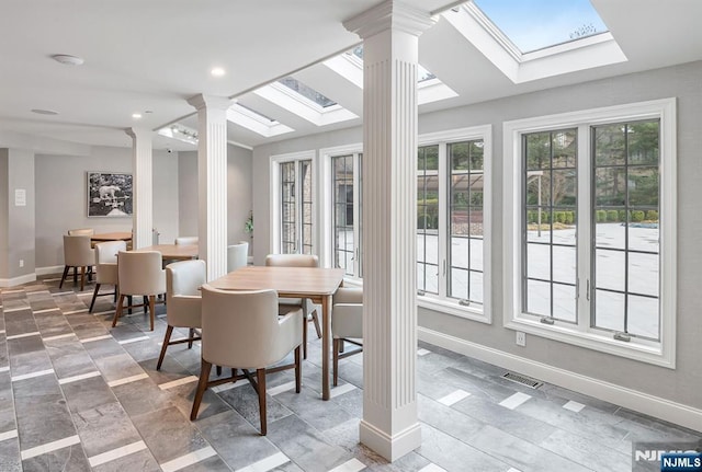 sunroom / solarium with visible vents and ornate columns