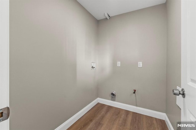 laundry room with hookup for a gas dryer, wood-type flooring, and hookup for a washing machine