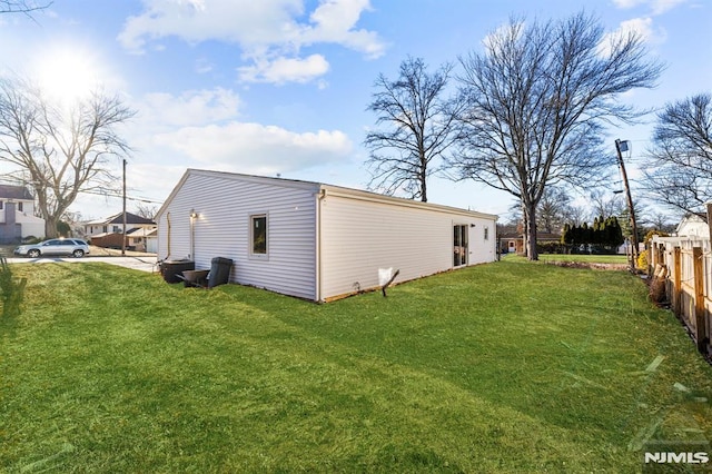 view of property exterior featuring a yard