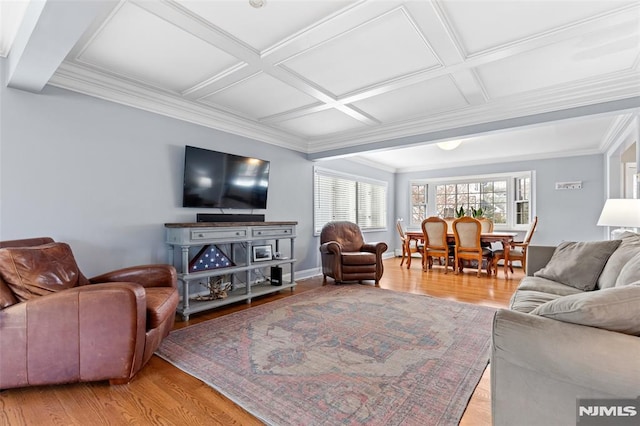 living room featuring beamed ceiling, light hardwood / wood-style floors, ornamental molding, and coffered ceiling