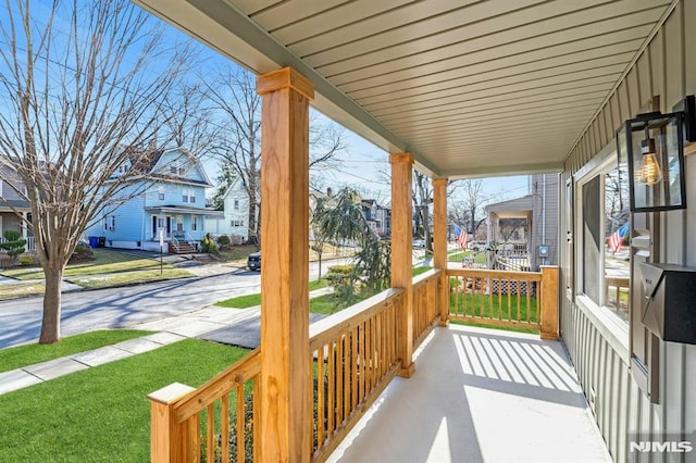 balcony featuring covered porch