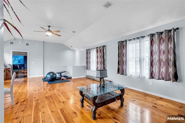 interior space featuring ceiling fan, light hardwood / wood-style flooring, and vaulted ceiling