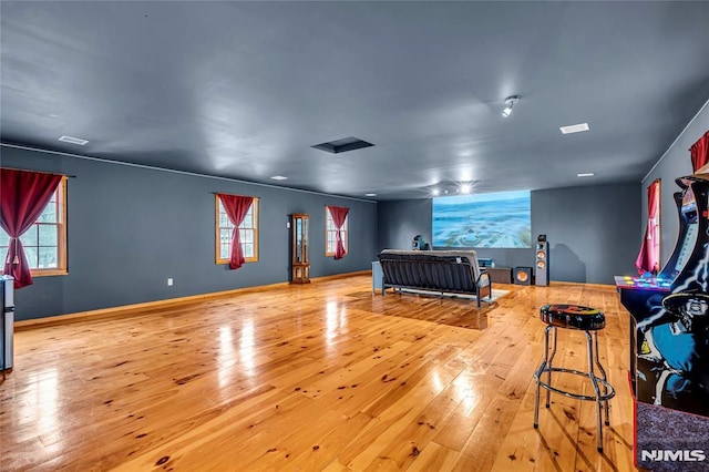 bedroom featuring light hardwood / wood-style floors and multiple windows