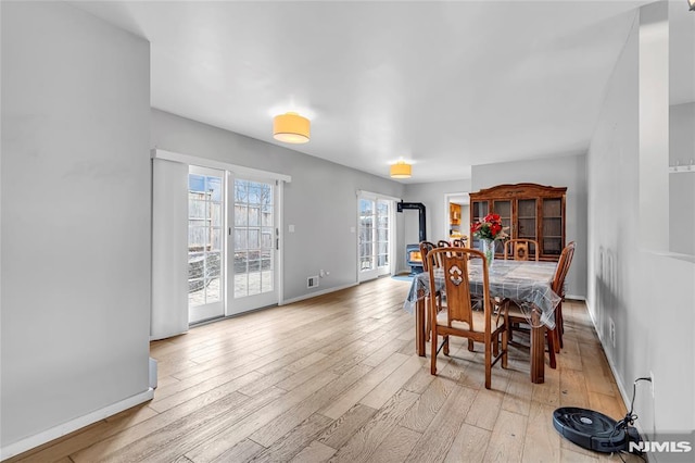 dining space featuring light hardwood / wood-style floors